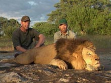 Butch and Richard Fuller with a lion
